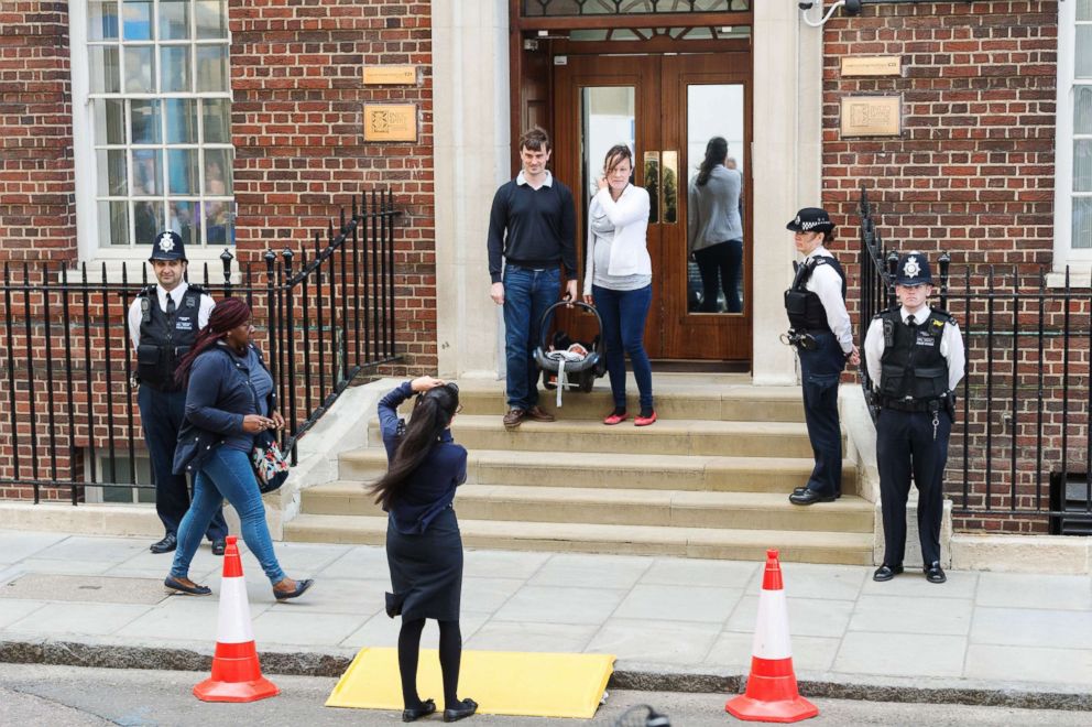 PHOTO: A couple with their newborn baby pose for photos outside the Lindo Wing at St Mary's Hospital, London, April 23, 2018.