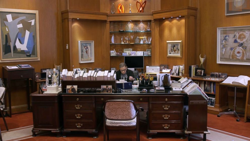 PHOTO: Associate Justice of the Supreme Court Ruth Bader Ginsburg works in an office in a scene from the movie, "RBG."