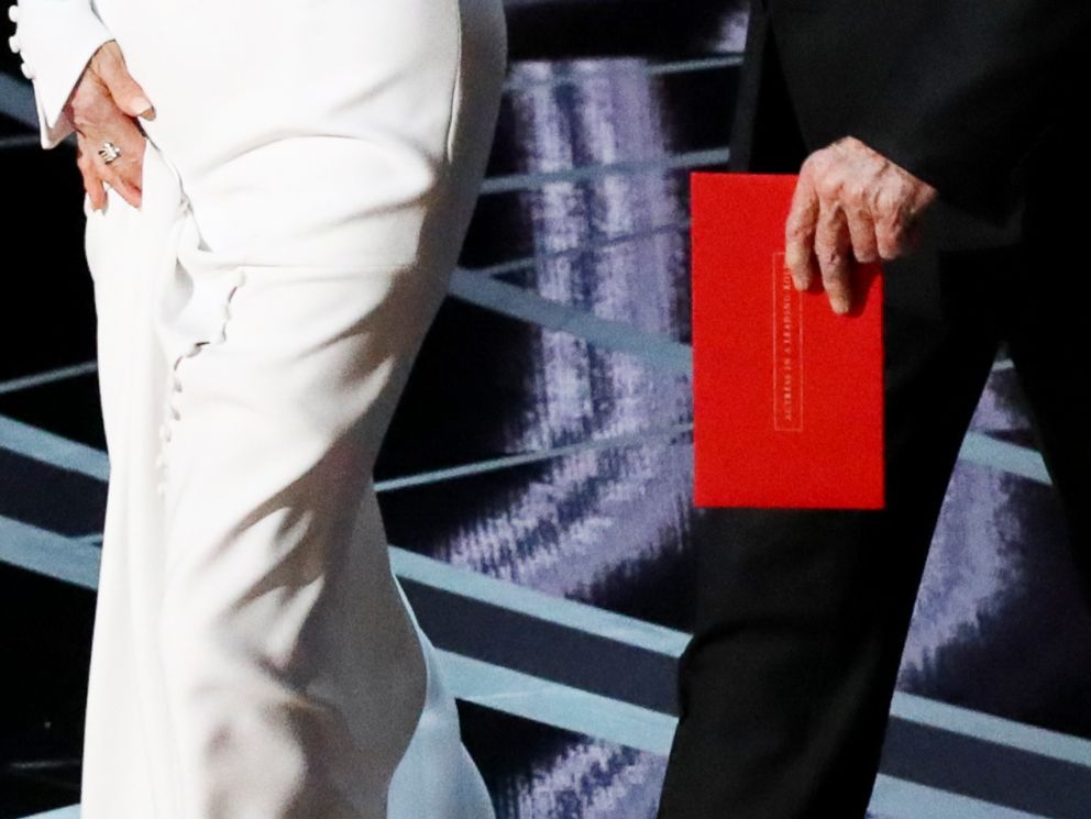 PHOTO: Warren Beatty carries an envelope reading Actress in a Leading Role as he walks on stage with Faye Dunaway to present the Oscar for Best Picture during the 89th Academy Awards in Los Angeles, Feb. 26, 2017.