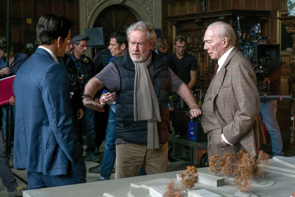 PHOTO: Mark Wahlberg, left, and Christopher Plummer, right, listening to director Ridley Scott on the set of All The Money In The World. 