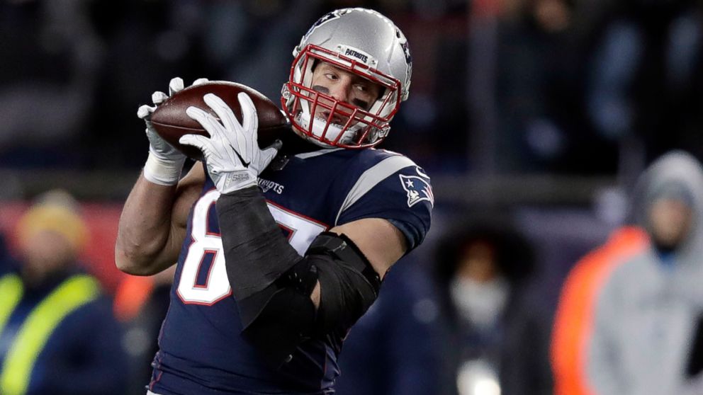 PHOTO: New England Patriots tight end Rob Gronkowski catches a pass in front of Tennessee Titans linebacker Wesley Woodyard during the second half of an NFL divisional playoff football game in Foxborough, Mass., Jan. 13, 2018. 