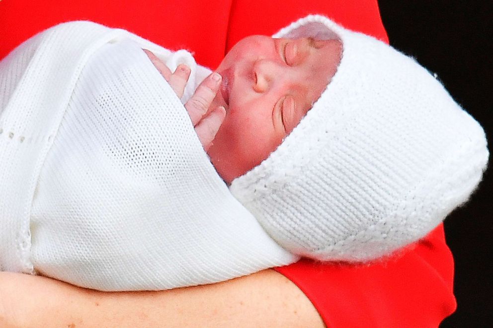 PHOTO: Britain's Catherine, Duchess of Cambridge, holds her newly-born son, her third child, as she and her husband Britain's Prince William, Duke of Cambridge show him to the media outside the Lindo Wing at St Mary's Hospital, April 23, 2018, in London.