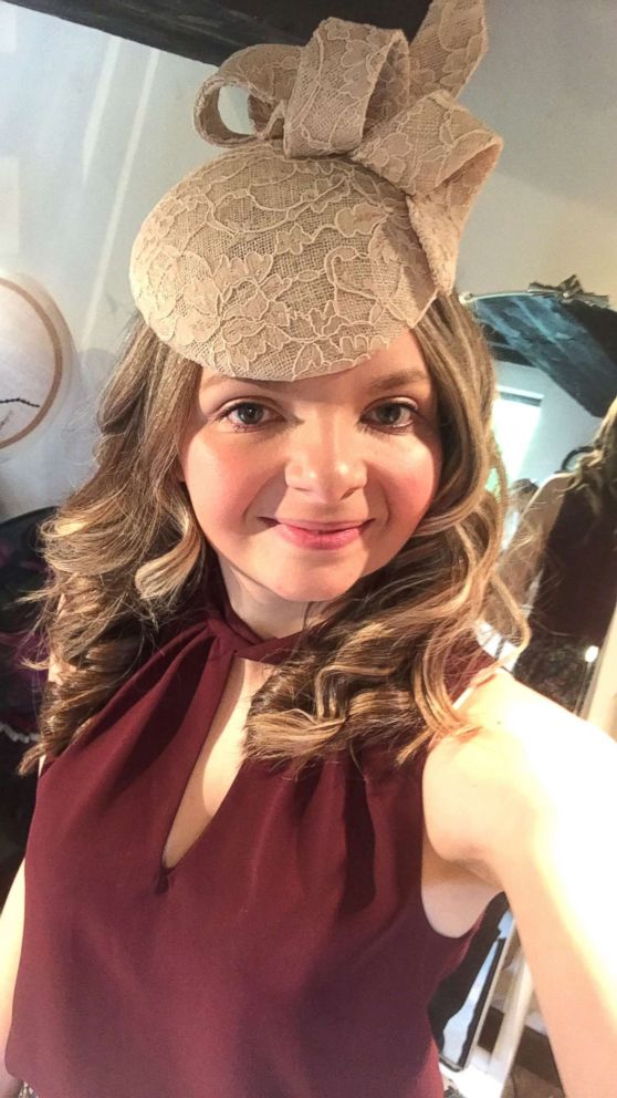 PHOTO: Kimberley Watkins is seen here trying on a fascinator made by Sara Gadd Millinery.