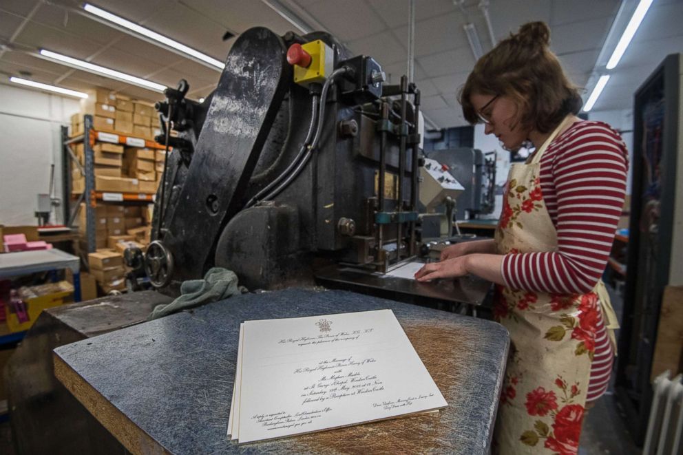 PHOTO: Lottie Small uses the die stamping press at the workshop of Barnard and Westwood in London, the company is printing the invitations for Prince Harry and Meghan Markle's upcoming wedding, March 22, 2018.