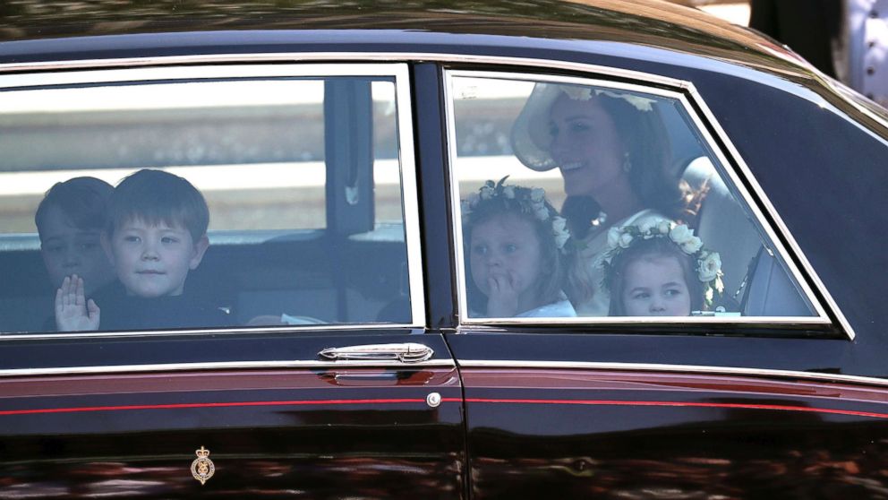 PHOTO: Kate, the Duchess of Cambridge arrives with Prince George, left and Princess Charlotte, right, for the wedding  ceremony of Prince Harry and Meghan Markle at St. George's Chapel in Windsor Castle in Windsor, May 19, 2018. 