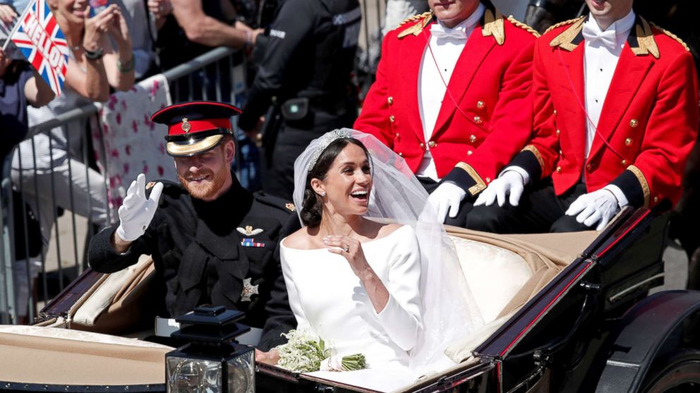 PHOTO: Prince Harry and his wife Meghan ride a horse-drawn carriage after their wedding ceremony at St George's Chapel in Windsor Castle in Windsor, May 19, 2018.