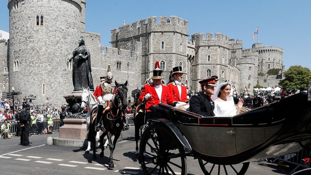 PHOTO: Prince Harry, Duke of Sussex and The Duchess of Sussex leave Windsor Castle in the Ascot Landau carriage during a procession after getting married at St Georges Chapel on May 19, 2018 in Windsor.