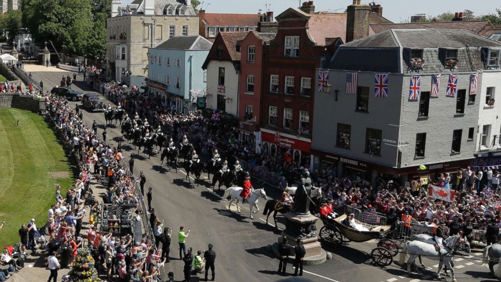 PHOTO: Prince Harry and Meghan Markle react and wave as they leave Windsor Castle in a carriage after their wedding ceremony at St. George's Chapel in Windsor Castle in Windsor, May 19, 2018.