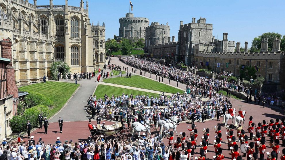 PHOTO: Prince Harry, Duke of Sussex and Meghan, The Duchess of Sussex, leave Windsor Castle in the Ascot Landau carriage during a procession after getting married at St Georges Chapel on May 19, 2018 in Windsor.