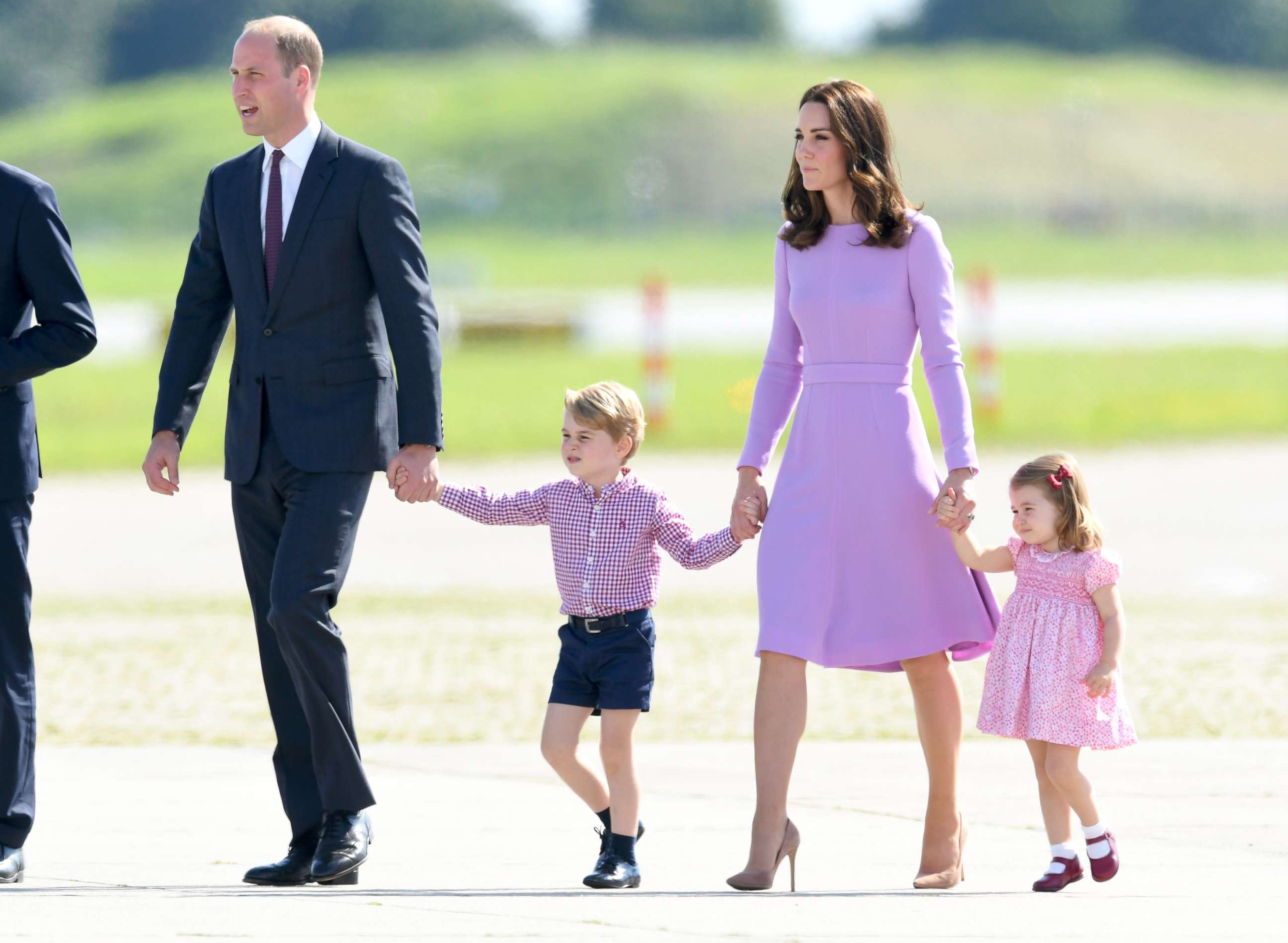 PHOTO: Prince William, Duke of Cambridge, Prince George, Catherine, Duchess of Cambridge and Princess Charlotte of Cambridge, before departing from Hamburg airport, July 21, 2017 in Hamburg, Germany. 