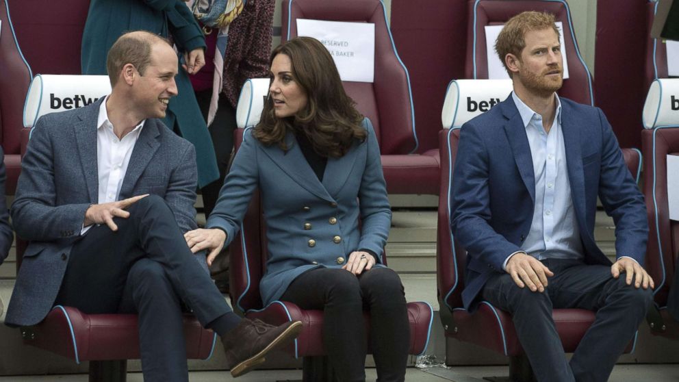 PHOTO: Britain's Prince William, Duke of Cambridge and Britain's Catherine, Duchess of Cambridge share a light moment as Britain's Prince Harry looks on during their visit to attend the graduation ceremony, in east London, Oct. 18, 2017. 