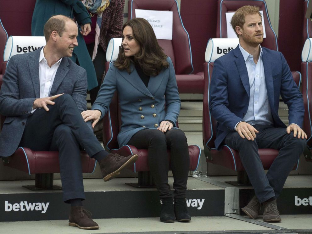 PHOTO: Britain's Prince William, Duke of Cambridge and Britain's Catherine, Duchess of Cambridge share a light moment as Britain's Prince Harry looks on during their visit to attend the graduation ceremony, in east London, Oct. 18, 2017. 