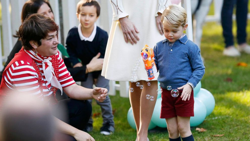 PHOTO: Prince George plays with a bubble gun at a children's party at Government House in Victoria, British Columbia, Canada, Sept. 29, 2016.  