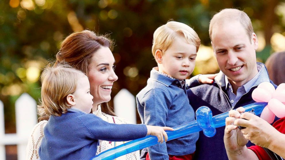 Britain's Prince William (2nd R), Catherine, Duchess of Cambridge (2nd L), Prince George and Princess Charlotte (L) watch as a man inflates balloons at a children's party at Government House in Victoria, British Columbia, Canada, Sept. 29, 2016. 