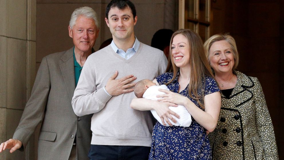 Chelsea Clinton holds her newborn son Aidan Clinton Mezvinsky with her husband Marc Mezvinsky, Hillary Clinton and former President Bill Clinton as they exit Lenox Hill Hospital in New York.