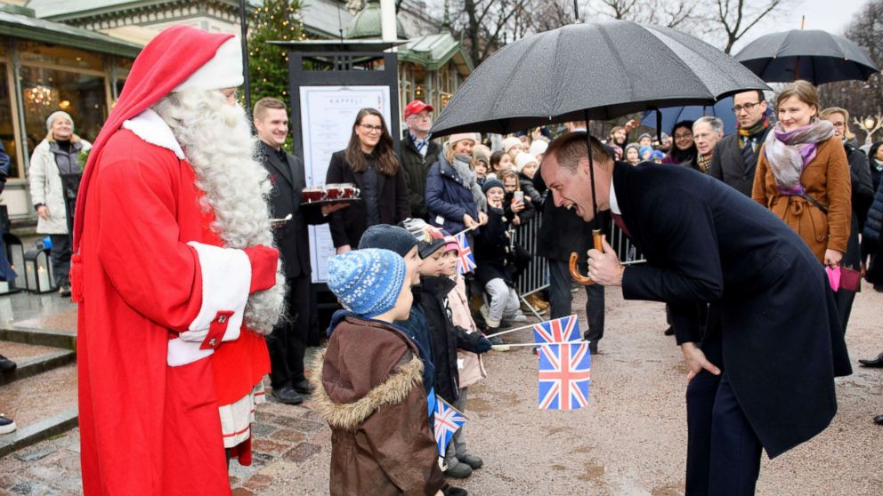 PHOTO: Prince William gives a Christmas list from Prince George to Santa Claus at Esplanade Park's Christmas market in Helsinki, Nov. 30, 2017.