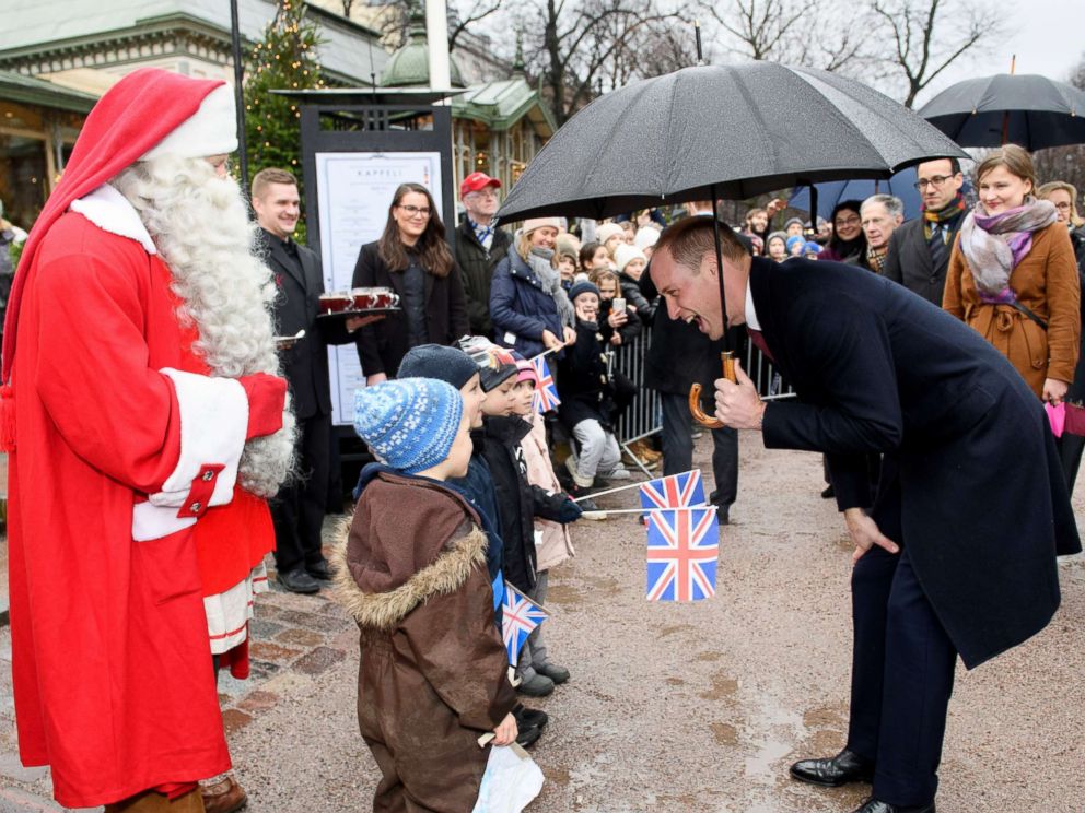 PHOTO: Prince William gives a Christmas list from Prince George to Santa Claus at Esplanade Park's Christmas market in Helsinki, Nov. 30, 2017.