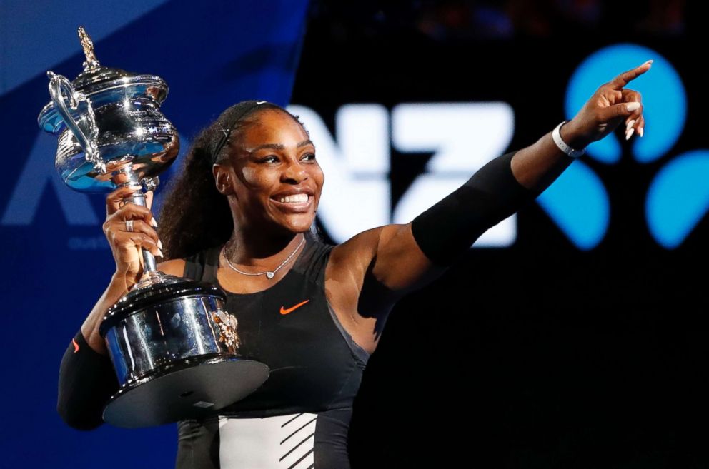 PHOTO: Serena Williams holds her trophy after defeating her sister Venus in the women's singles final at the Australian Open tennis championships in Melbourne, Australia, Jan. 28, 2017.