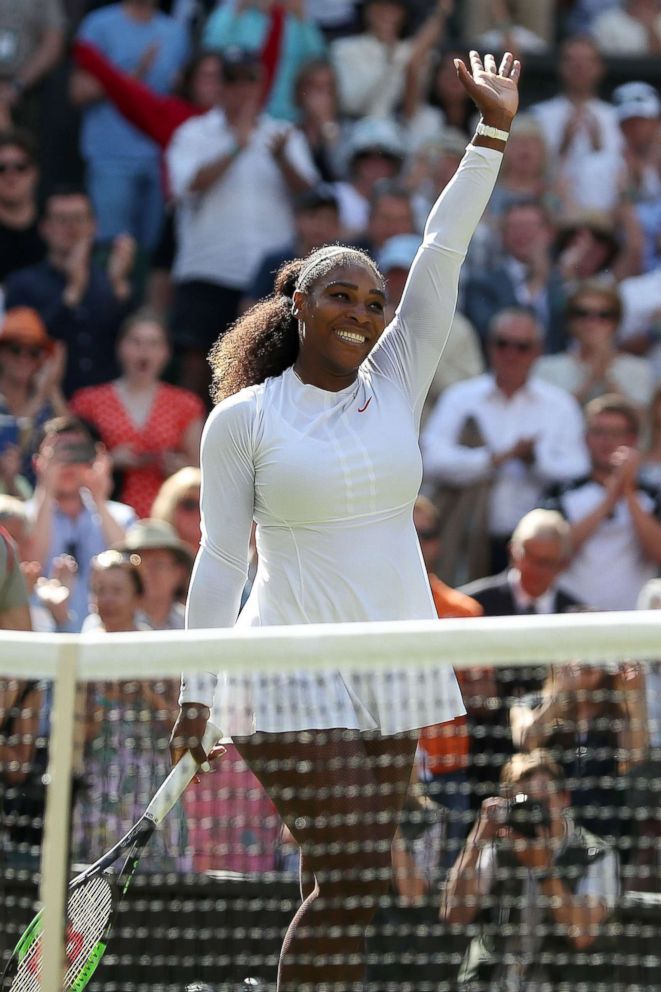 PHOTO: Serena Williams celebrates after winning against Italy's Camila Giorgi during their women's singles quarter-final match on the eighth day of the 2018 Wimbledon Championships at The All England Lawn Tennis Club in Wimbledon, London, July 10, 2018.