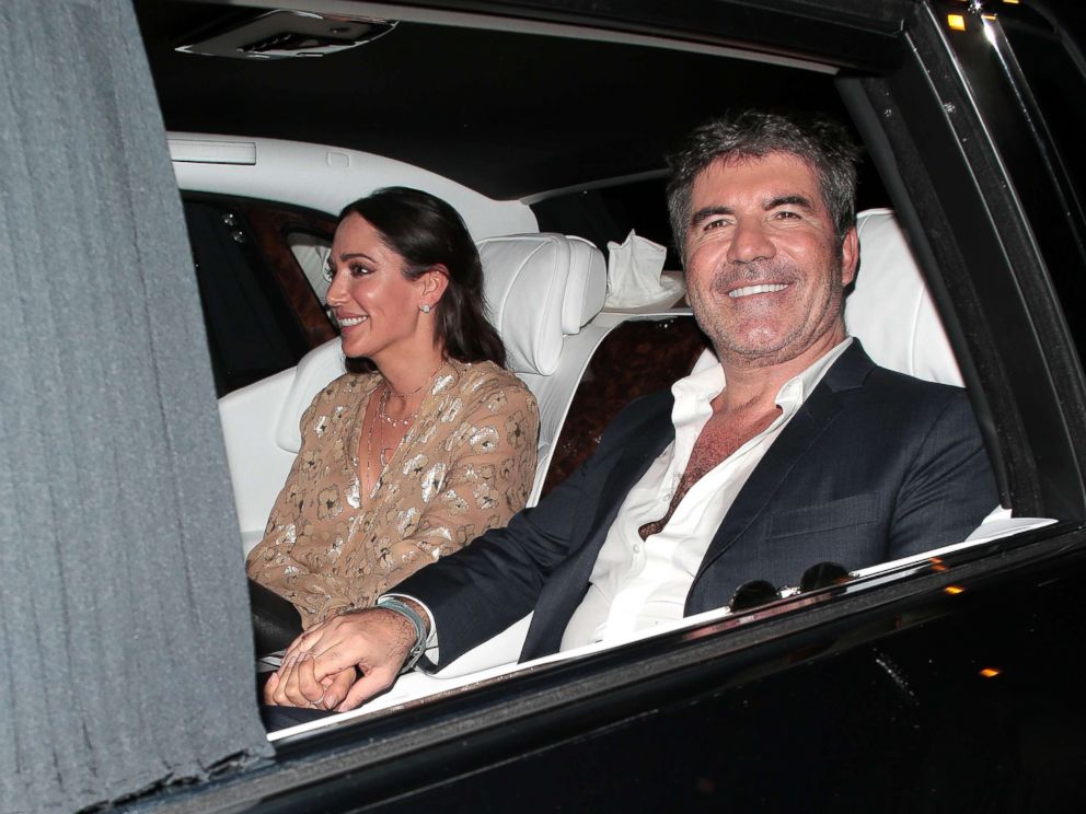 PHOTO: Lauren Silverman and Simon Cowell seen leaving Hammersmith Apollo after Britains Got Talent - semi final day 3, May 30, 2018 in London, England.