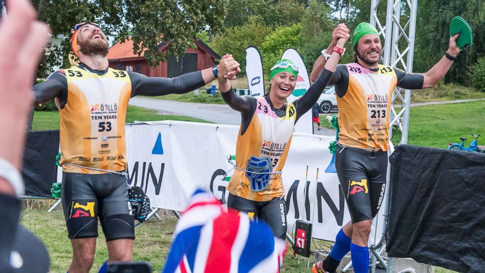 PHOTO: Pippa Middleton and her running partners raise their hands as they cross the finish line of the Otillo Race in Sweden, Sept. 7, 2015.