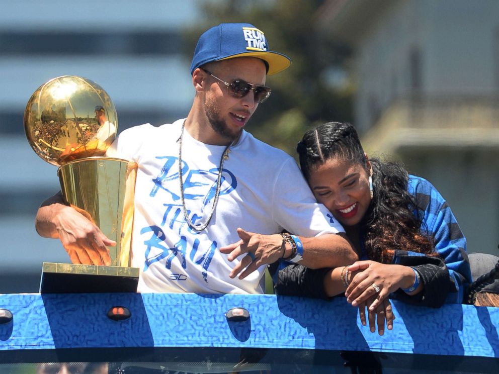 PHOTO: Stephen Curry holds the NBA Championship Trophy as he and his wife, Ayesha Curry ride in the Golden State Warriors' championship parade in downtown Oakland, Calif., June 12, 2018.