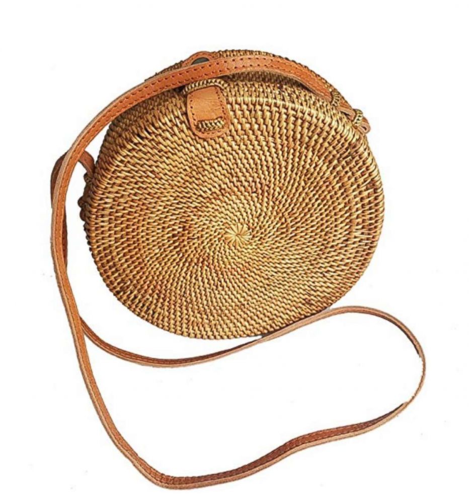 PHOTO: This year’s summer bag is the sleek and compact round crossbody, in straw.