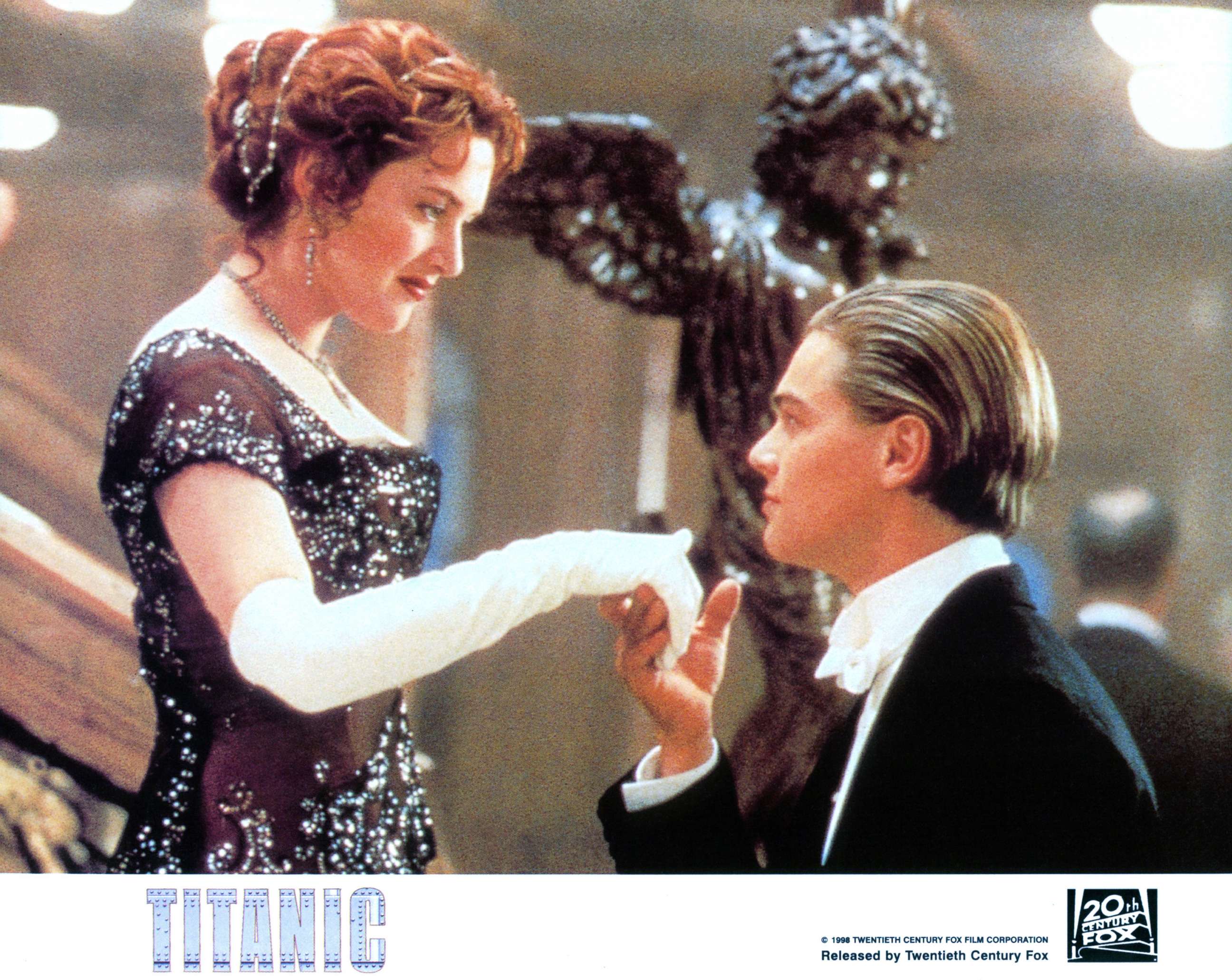 PHOTO: Kate Winslet offers her hand to Leonardo DiCaprio in a scene from the film 'Titanic', 1997.