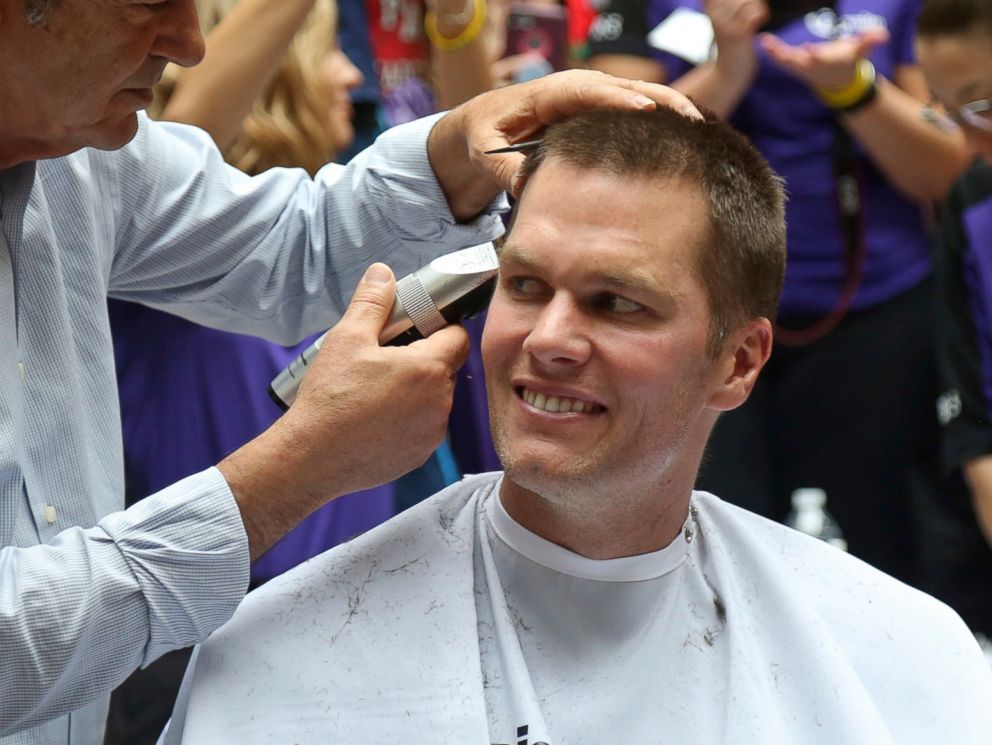 PHOTO: New England Patriots quarterback Tom Brady gets his head shaved by Pini Swissa at the "Saving By Shaving" event in support of the Dana-Farber Cancer Institute at Granite Telecommunications in Quincy, Mass., March 8, 2018.