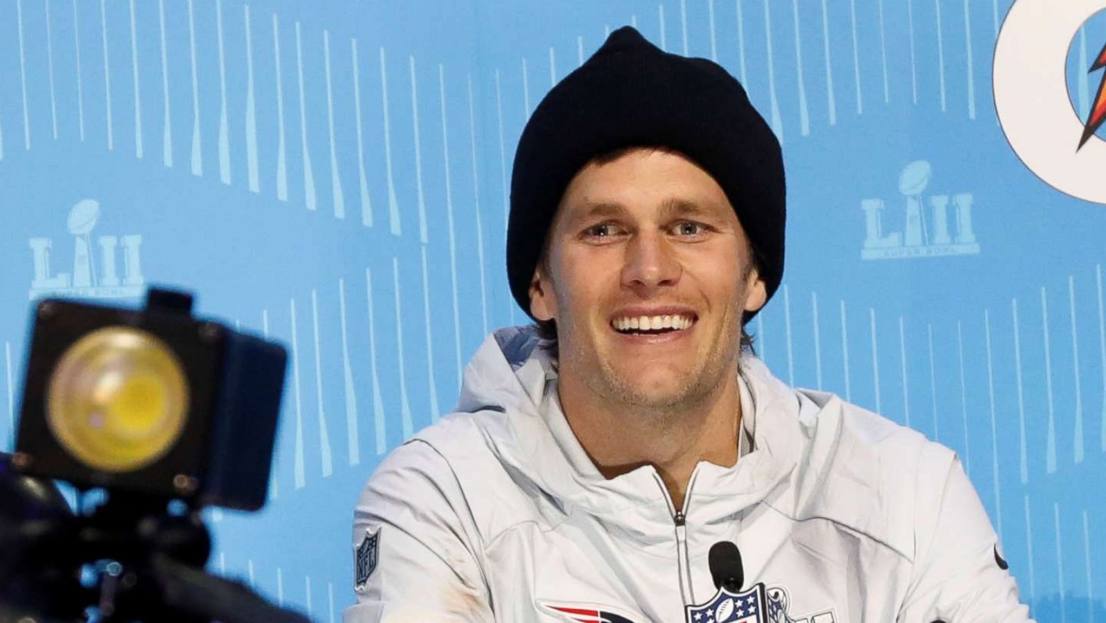 PHOTO: New England Patriots quarterback Tom Brady smiles as he speaks to reporters during Super Bowl Opening Night at the Xcel Energy Center in St. Paul, Minn., Jan. 29, 2018.