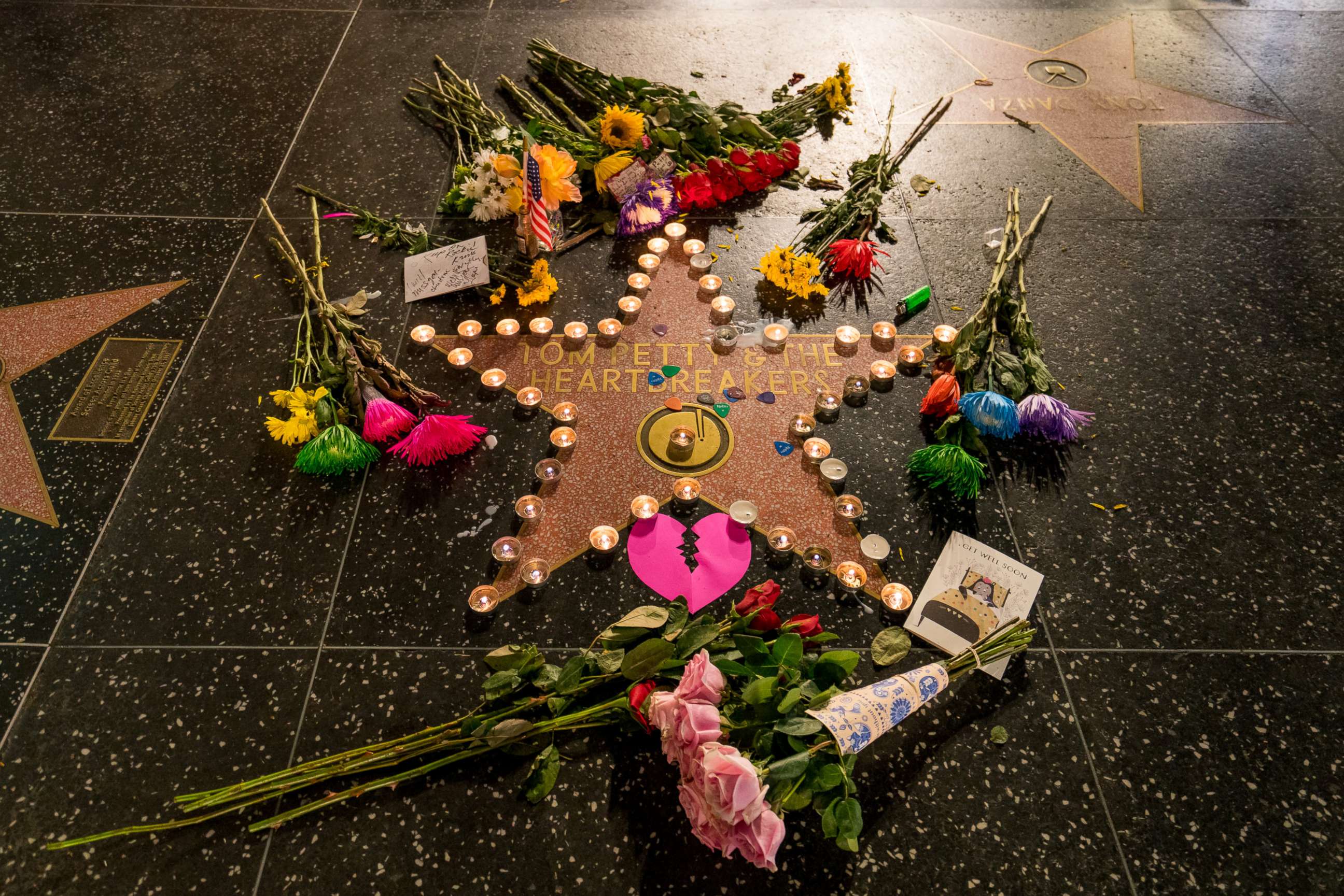 PHOTO: Fans leave flowers on  Tom Petty's star on the Hollywood Walk of Fame after the announcement of his death, Oct. 2, 2017, in Los Angeles.  