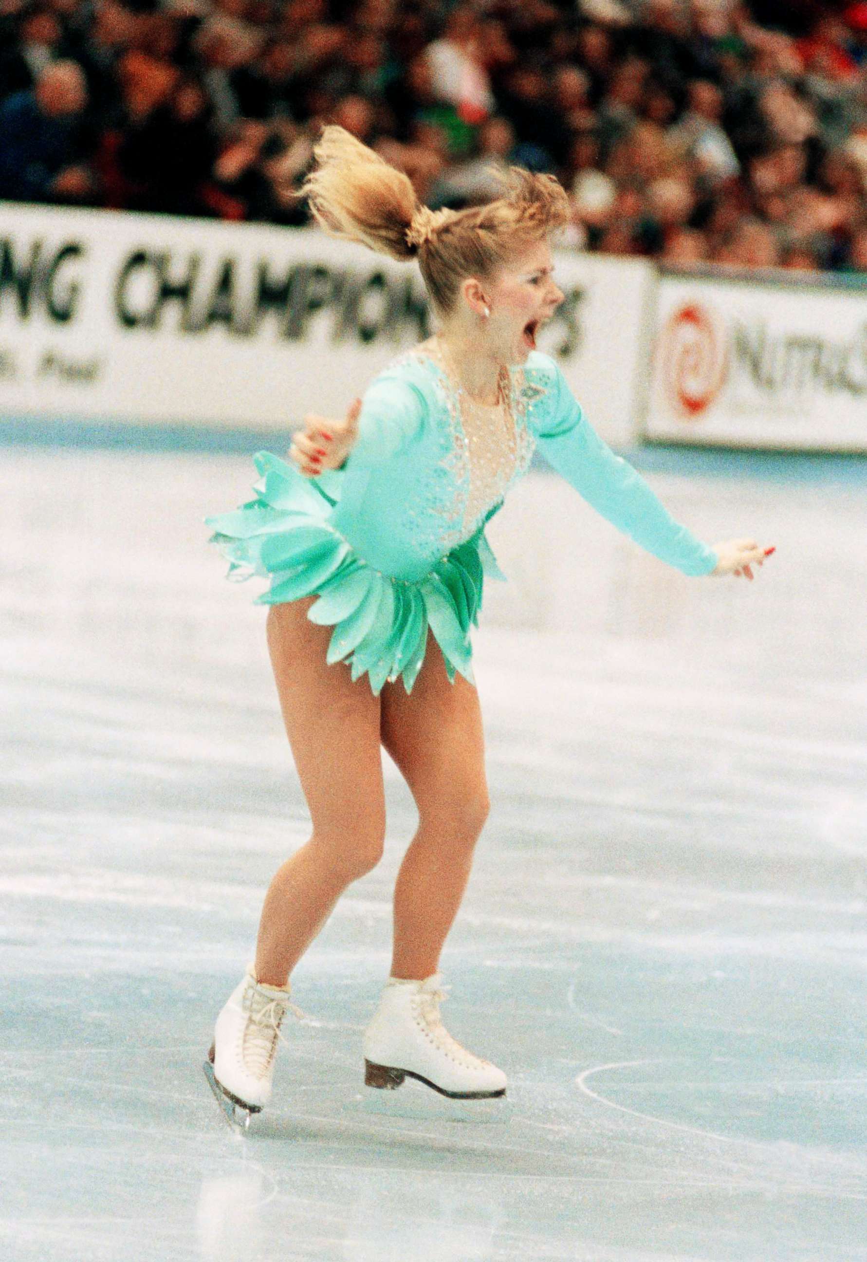 PHOTO: A jubilant Tonya Harding is acknowledged by the crowd as she comes out of her successful triple axel on her way to winning the U.S. Figure Skating Championships on Feb. 16, 1991, in Minneapolis. 