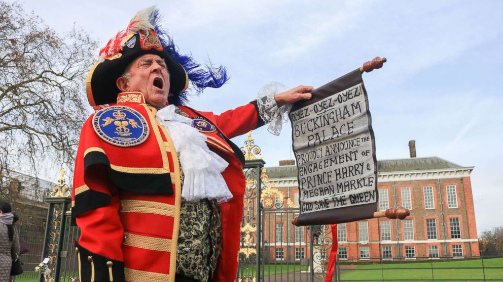 PHOTO: A town crier outside Kensington Palace announces the Royal engagement of Prince Harry to Meghan Markle, Nov. 27, 2017, in London.