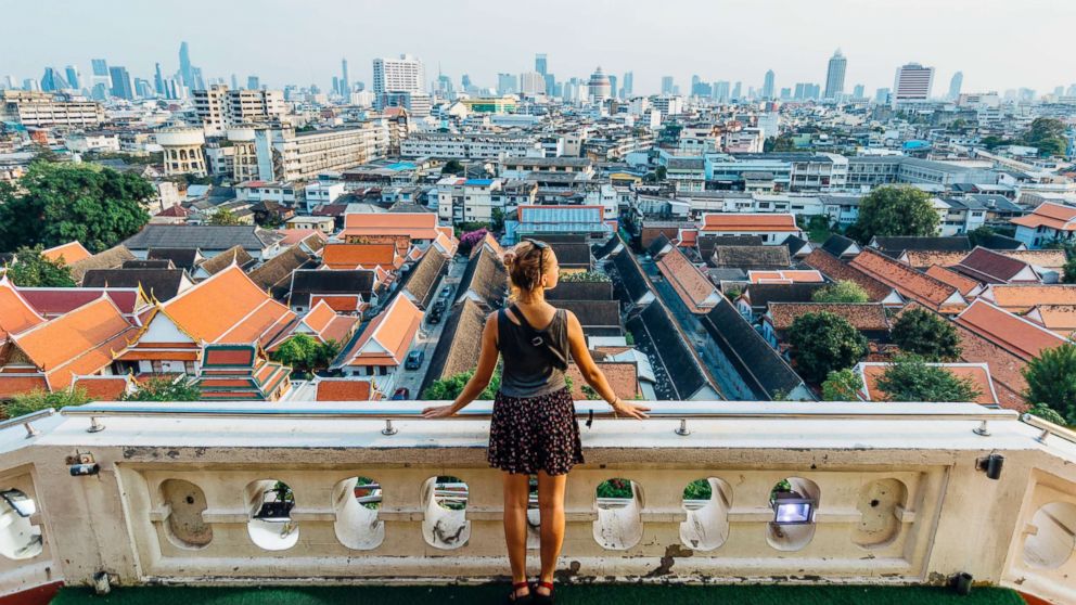 A tourist looks out over a city in this undated stock image.