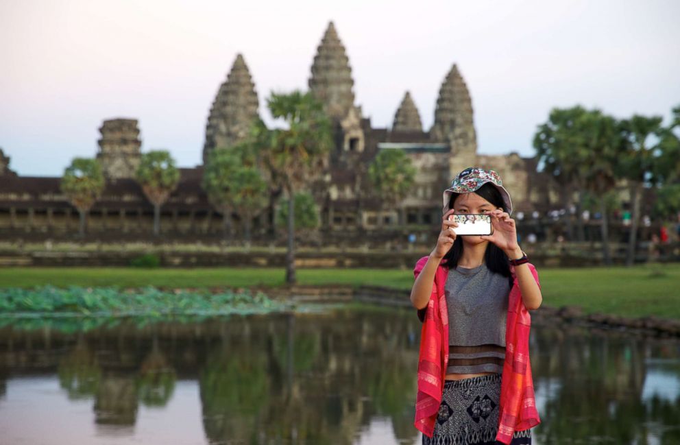 PHOTO: A visitor takes a selfie at Angkor Wat, Cambodia.