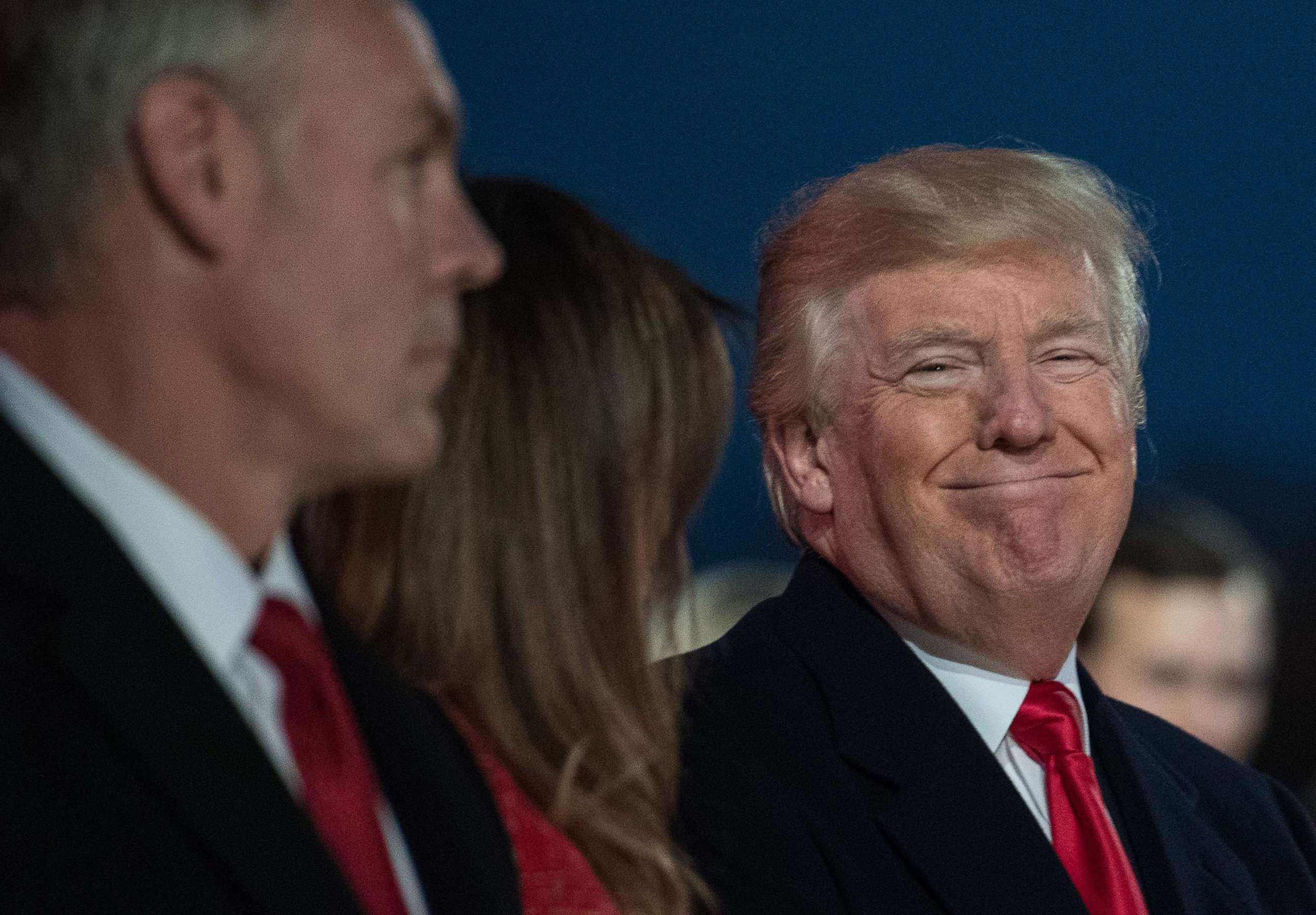PHOTO: President Donald Trump smiles as Secretary of the Interior Ryan Zinke looks on during the 95th annual National Christmas Tree Lighting ceremony in President's Park near the White House in Washington on Nov. 30, 2017.