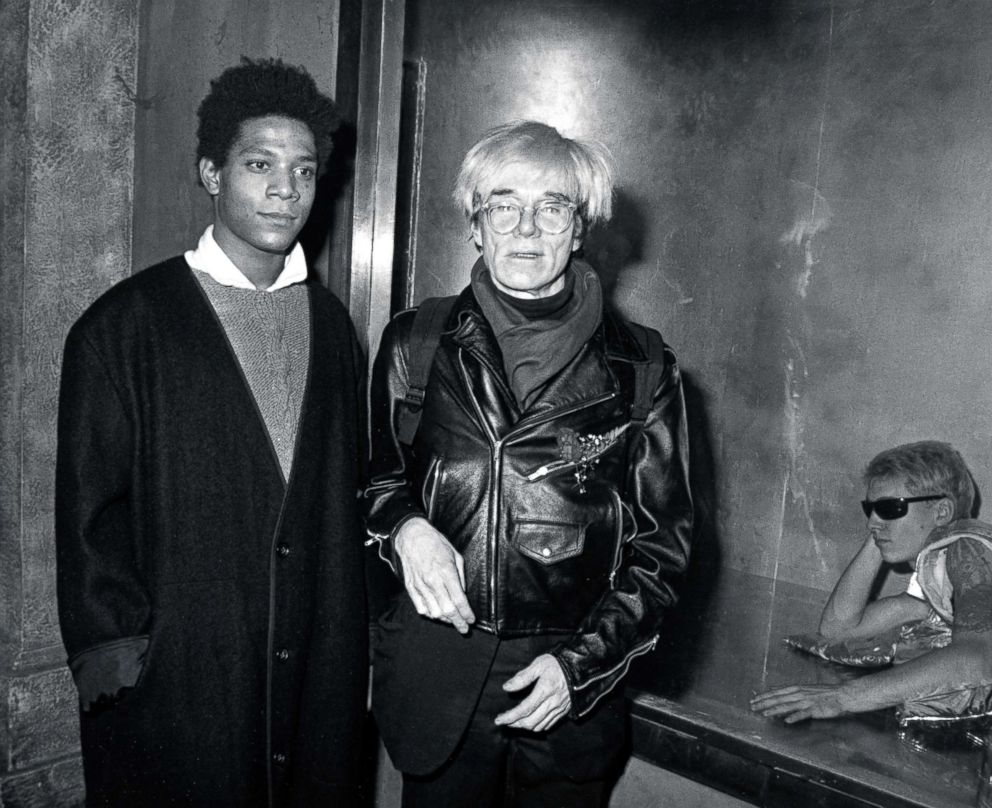 PHOTO: Jean Michael Basquait and Andy Warhol during "Gifts For the City of New York" Benefit Festival at Area Nightclub in New York, Nov. 7, 1984.