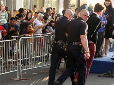 VIDEO: The man was led away in handcuffs and arrested on battery charges in Los Angeles.