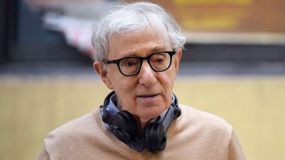 Woody Allen walks on a film set in Manhattan, Sept. 11, 2017, in New York.  