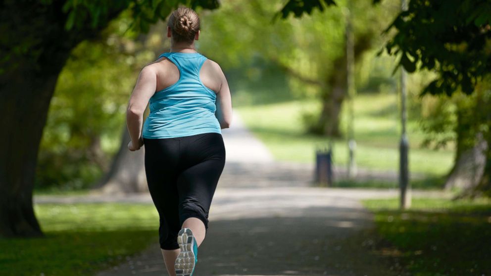 A woman jogs in this stock photo.