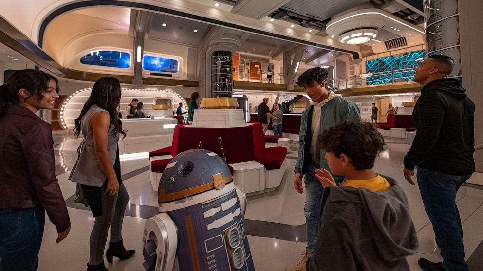 PHOTO: Astromech droid SK-62O greets guests in the Atrium of the Halcyon starcruiser in Star Wars: Galactic Starcruiser at Walt Disney World Resort in Lake Buena Vista, Fla. 