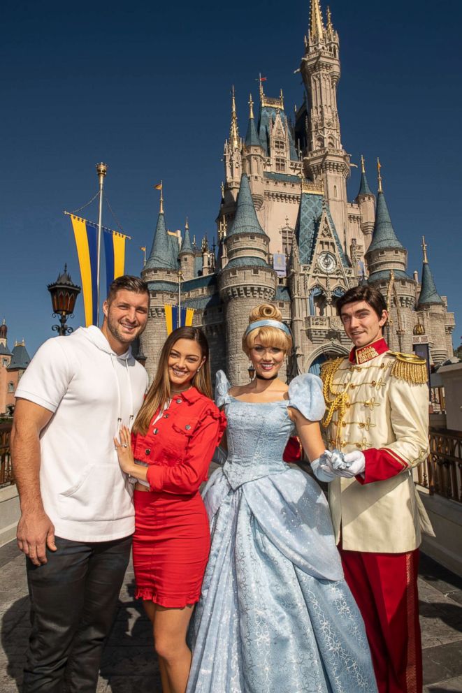 PHOTO: Professional athlete and sports analyst Tim Tebow and fiancee Demi-Leigh Nel-Peters strike a pose with Cinderella and Prince Charming at Magic Kingdom Park at Walt Disney World Resort in Lake Buena Vista, Fla., Friday, Jan. 11, 2019.