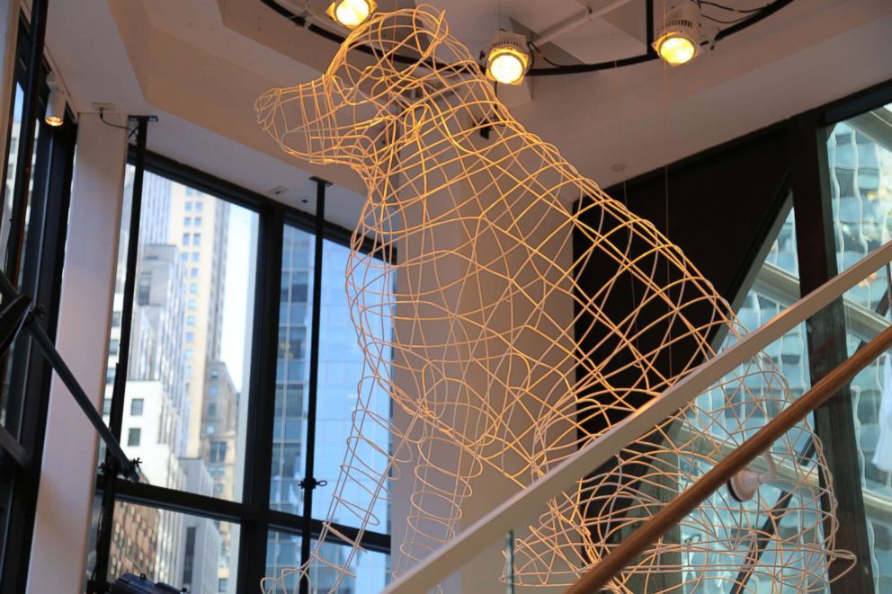 PHOTO: This large dog sculpture hangs from the ceiling and lights up different colors depending on the occasion.