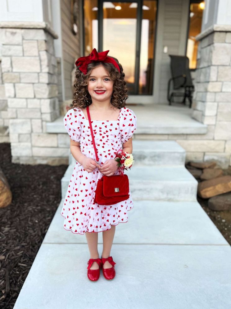 PHOTO: Austyn wore a white dress decorated with red hearts, a red bow headband, and matching red shoes to the Valentine's Day daddy-daughter dance on Feb. 8.