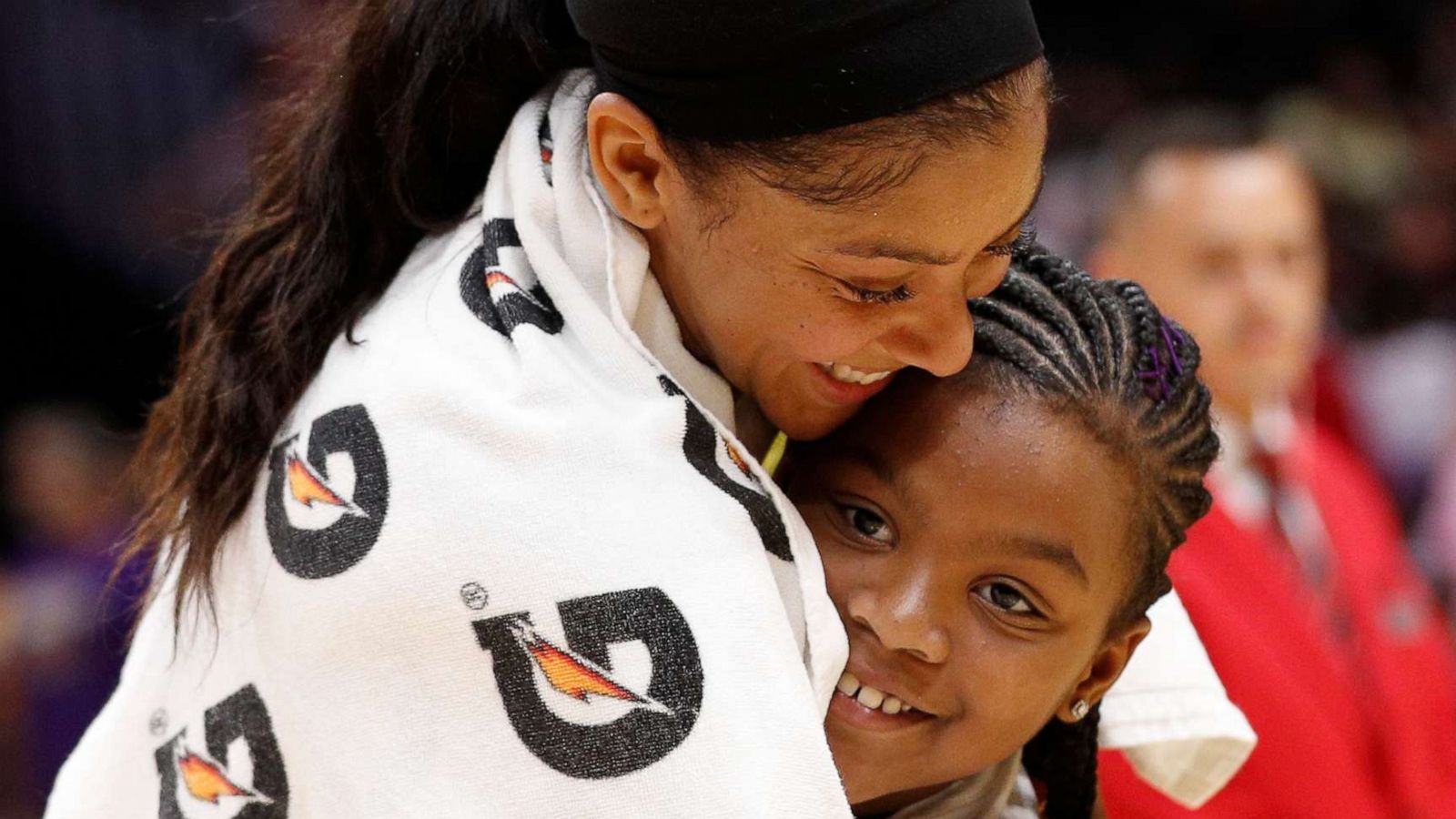 PHOTO: LOS ANGELES, CALIFORNIA - AUGUST 08: Forward Candace Parker #3 of the Los Angeles Sparks hugs her daughter, Lailaa Nicole Williams, after winning the game against the Phoenix Mercury at Staples Center on August 08, 2019 in Los Angeles, California.