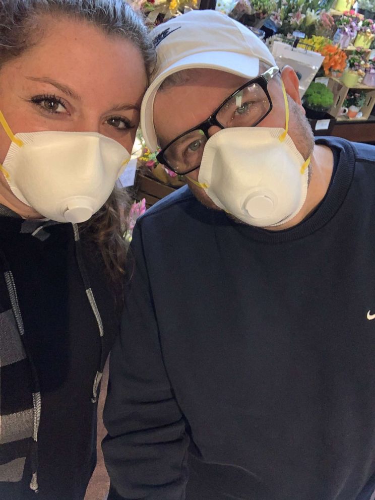 PHOTO: Greg Dailey and daughter Erin Dailey shop for groceries with face masks.