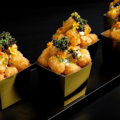 PHOTO: New "bougie" tater tots topped with crème fraîche, caviar and herbs to be served at the 31st Governors Ball Oscars after party. 