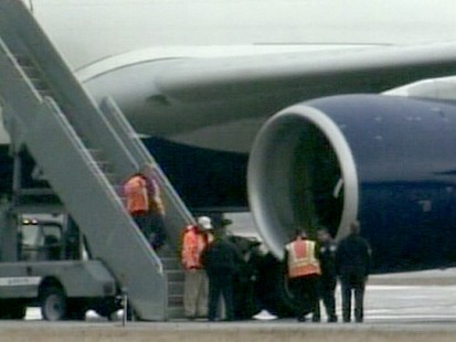 VIDEO: Nigerian passenger allegedly attempted to ignite explosives taped to legs.
