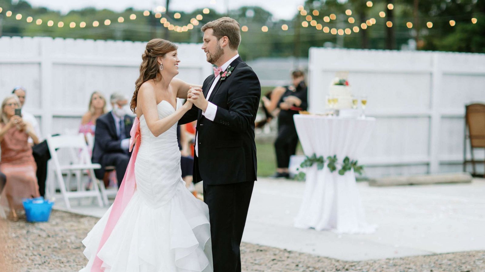 PHOTO: Carrie and John Michael Simpson dance in a parking lot on their wedding day last month.