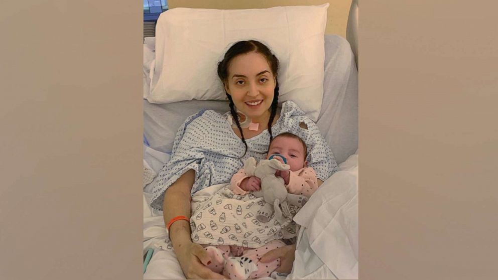 PHOTO: Serena Torres holds her daughter Alessandra while in the hospital recovering from COVID-19.